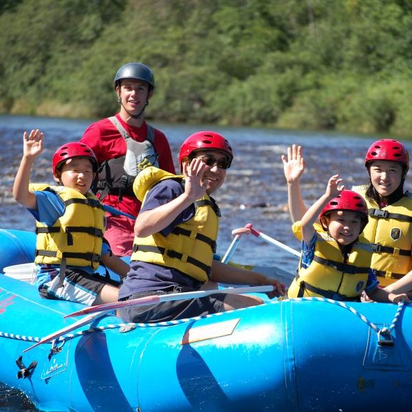 Family of 4 on a river raft