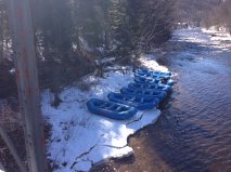 Six rafts on the frozen riverside in winter.