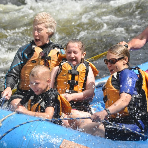 Family of 4 with guide in a raft on the Kennebec River