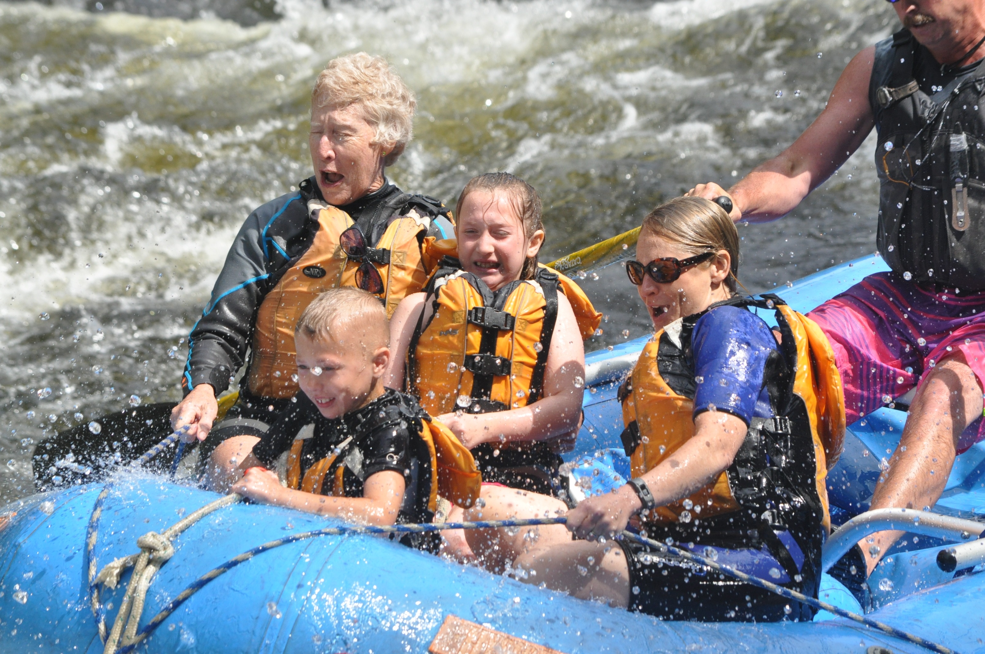 Family of 4 with guide in a raft on the Kennebec River